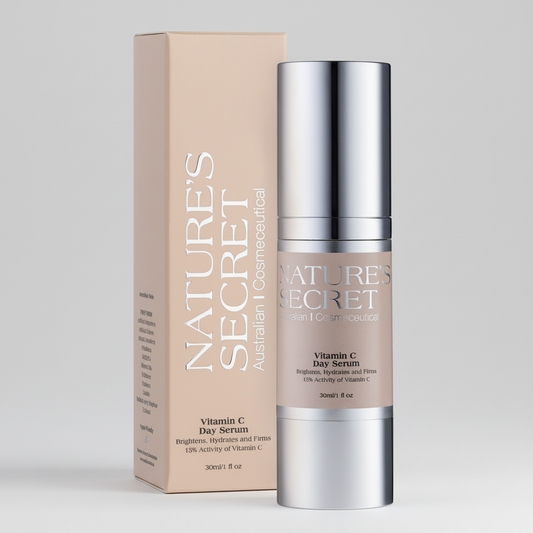Nature's Secret Vitamin C Day Serum in a silver pump bottle with a beige label, standing next to its beige cardboard packaging box on a light gray background.