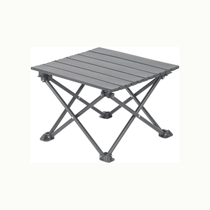 A dark gray portable folding camp table with a slatted top and X-frame legs, shown on a plain off-white background.
