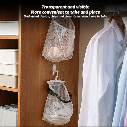 Two white mesh hanging shoe bags with white plastic hooks, shown inside a wooden closet organizer. One bag contains shoes, and the other is empty.